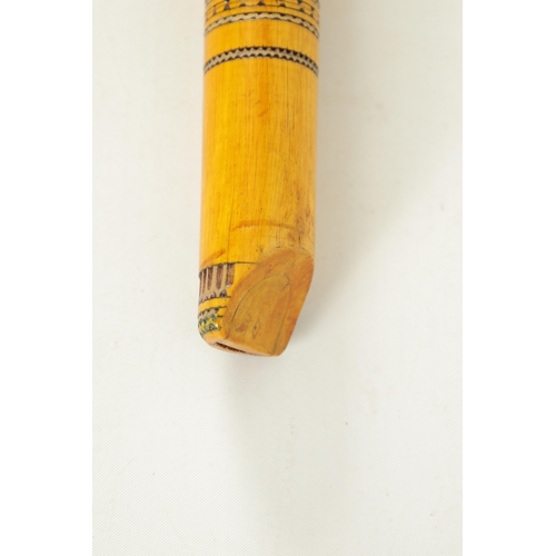 9 - A LATE 20TH CENTURY GREEK BAMBOO FLUTE having 8 finger holes, bands of engraved decoration, flowerhe... 