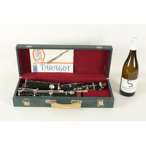 94 - A ROMANIAN TARAGOTO (SAXOPHONE) made with lacquered hardwood with silvered buttons and collars - com... 