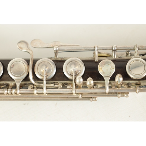 95 - A FINE CASED FLUTE BY RUDALL, CARTE & CO. LONDON in Boehm-carte system, the three piece flute turned... 