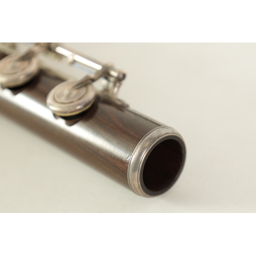 95 - A FINE CASED FLUTE BY RUDALL, CARTE & CO. LONDON in Boehm-carte system, the three piece flute turned... 