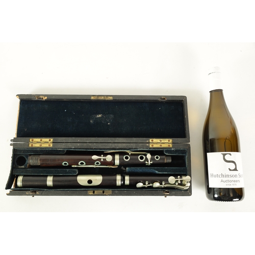 97 - A CASED ROSEWOOD CLASS A FLUTE BY T.E. PAGE, LONDON. The five section flute having nickel buttons an... 