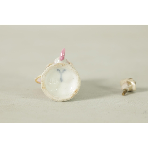 102 - AN 18TH CENTURY MEISSEN PURFUME BOTTLE AND STOPPER IN FITTED LEATHER CASE modelled as a standing cla... 