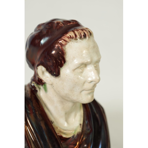 106 - A 19TH CENTURY PEARLWARE AND LUSTROUS GLAZED BUST SCULPTURED FIGURE OF CEASAR on a stepped square pl... 