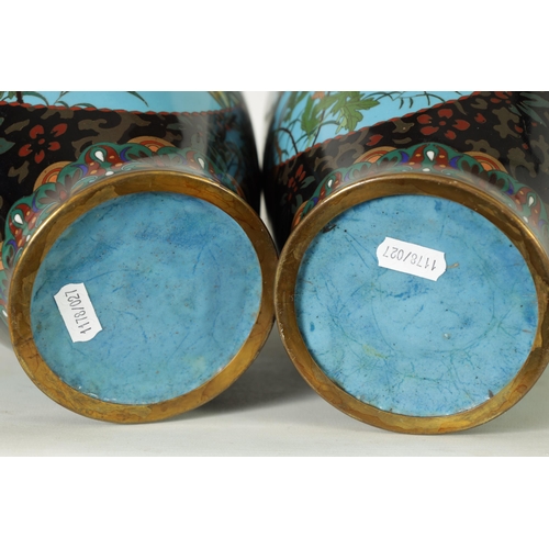 117 - A PAIR OF JAPANESE MEIJI PERIOD LARGE OVOID CLOISONNE VASES decorated bird in flowering landscape bl... 