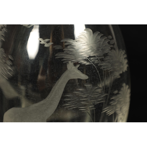 12 - A ROWLAND WARD SPIRIT DECANTER AND FACETTED STOPPER the ovoid body engraved with a giraffe in a tree... 