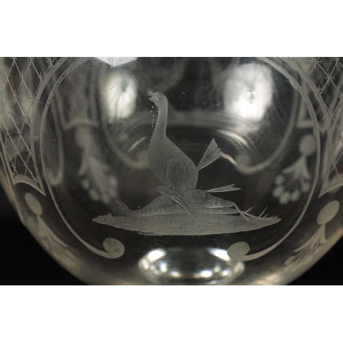 17 - AN OVERSIZED LATE GEORGIAN GLASS GOBLET the rounded bowl with frosted and cut engraved panels of coc... 