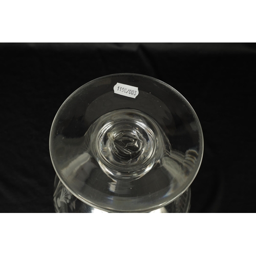 17 - AN OVERSIZED LATE GEORGIAN GLASS GOBLET the rounded bowl with frosted and cut engraved panels of coc... 