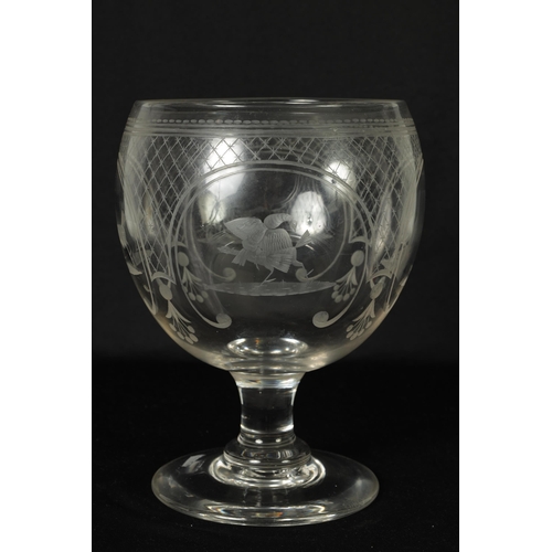 17 - AN OVERSIZED LATE GEORGIAN GLASS GOBLET the rounded bowl with frosted and cut engraved panels of coc... 