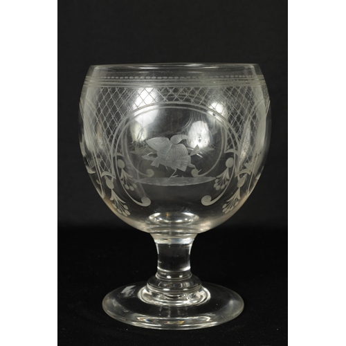 17 - AN OVERSIZED LATE GEORGIAN GLASS GOBLET the rounded bowl with frosted and cut engraved panels of coc... 