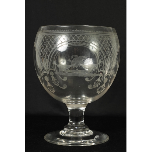 17 - AN OVERSIZED LATE GEORGIAN GLASS GOBLET the rounded bowl with frosted and cut engraved panels of coc... 