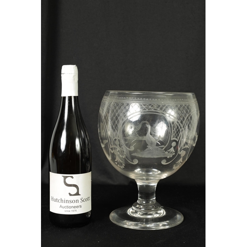 17 - AN OVERSIZED LATE GEORGIAN GLASS GOBLET the rounded bowl with frosted and cut engraved panels of coc... 