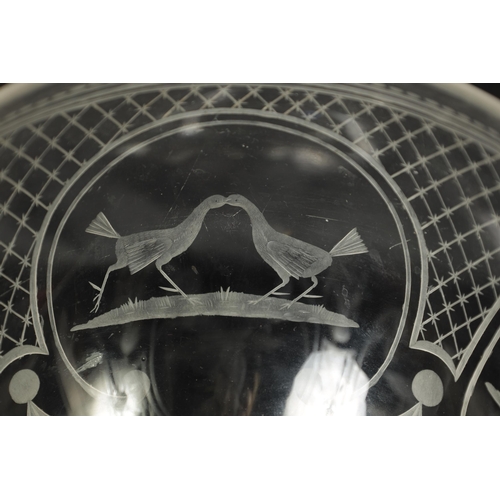 17 - AN OVERSIZED LATE GEORGIAN GLASS GOBLET the rounded bowl with frosted and cut engraved panels of coc... 