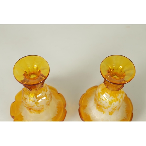 3 - A FINE PAIR OF 19TH CENTURY BOHEMIAN AMBER FLASHED GLASS DECANTERS decorated with Stags amongst wood... 