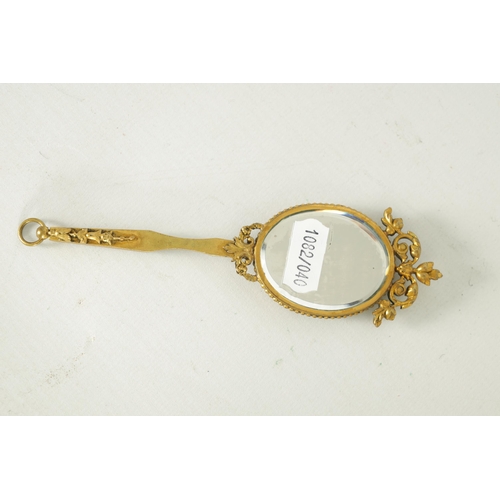 30 - A LATE 19TH CENTURY VIENNA PORCELAIN AND GILT METAL MINIATURE HAND MIRROR the oval convex plaque pai... 