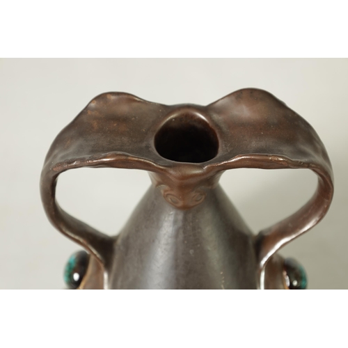 32 - A PAIR OF BRETBY ARTS AND CRAFTS SIMULATED COPPER WARE TWO HANDLED VASES with pinned raised lustrous... 