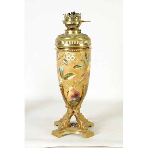 33 - A 19TH CENTURY CERAMIC AND CAST BRASS OIL LAMP with a detachable vessel and double burner, the conca... 