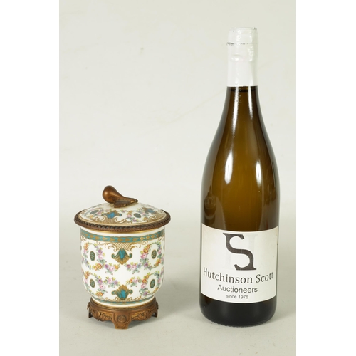 37 - AN 18TH CENTURY ORMOLU MOUNTED SERVES JAR AND COVER with shaped cut-out leafwork plinth and fruit fi... 