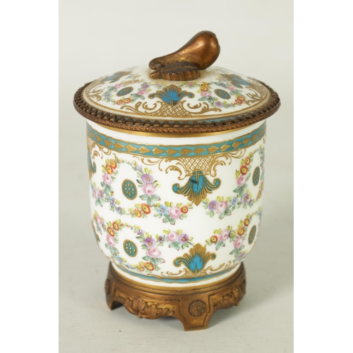 37 - AN 18TH CENTURY ORMOLU MOUNTED SERVES JAR AND COVER with shaped cut-out leafwork plinth and fruit fi... 