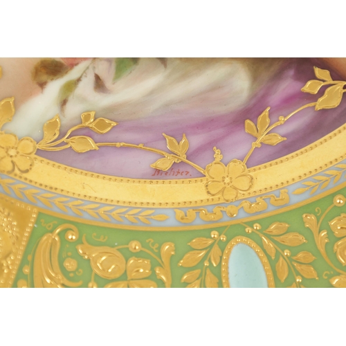 38 - A LATE 19TH CENTURY VIENNA PORCELAIN CABINET PLATE the richly jewelled gilded panelled green ground ... 