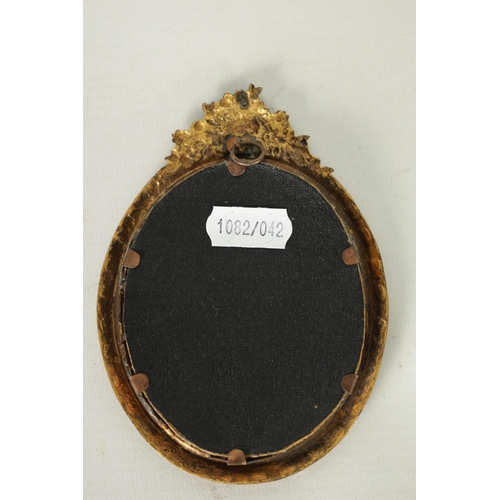 39 - A LATE 19TH CENTURY VIENNA PORCELAIN OVAL CONVEX MINIATURE PORTRAIT PLAQUE finely painted with a bus... 