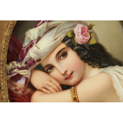 43 - A FINE MATCHED PAIR OF LATE 19TH CENTURY VIENNA OVAL CONVEX FRAMED PORCELAIN PLAQUES each depicting ... 