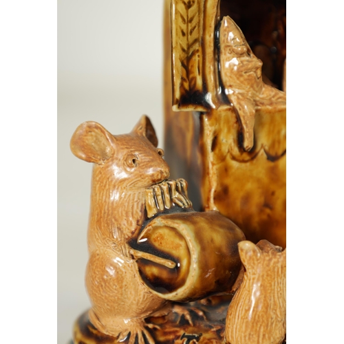 47 - A DOULTON LAMBETH TWO-TONE SHADED BROWN SALT GLAZED 'PLAY GOERS' GROUP OF MICE BY GEORGE TINWORTH CI... 