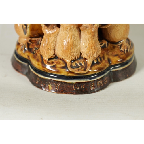 47 - A DOULTON LAMBETH TWO-TONE SHADED BROWN SALT GLAZED 'PLAY GOERS' GROUP OF MICE BY GEORGE TINWORTH CI... 