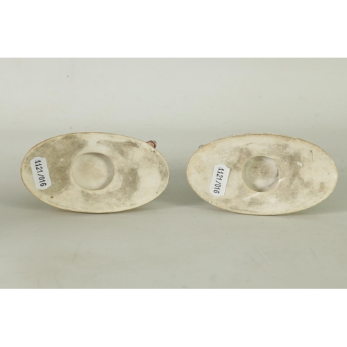 48 - A RARE PAIR OF EARLY 19TH CENTURY MINTON WAR AND PEACE FIGURINES finely modelled as children riding ... 