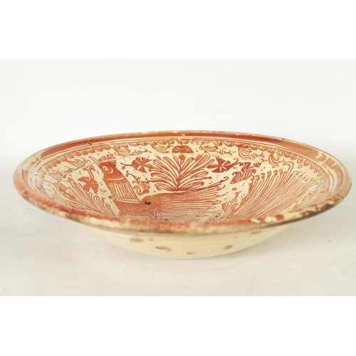 55 - A 17TH CENTURY COPPER LUSTRE HISPANO MORESQUE HANGING CHARGER decorated with central cockerel and sc... 