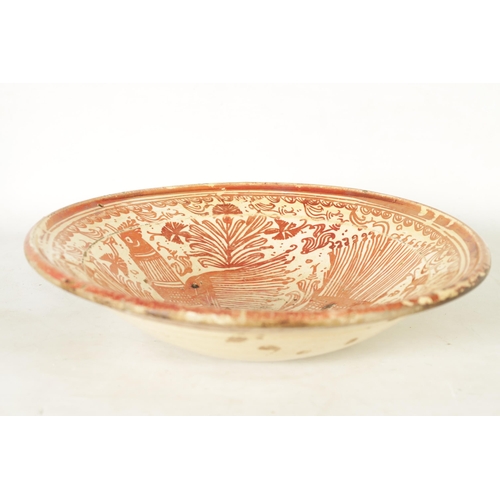 55 - A 17TH CENTURY COPPER LUSTRE HISPANO MORESQUE HANGING CHARGER decorated with central cockerel and sc... 