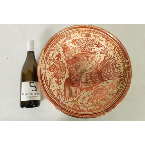 55 - A 17TH CENTURY COPPER LUSTRE HISPANO MORESQUE HANGING CHARGER decorated with central cockerel and sc... 