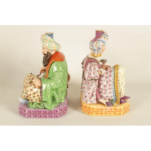 57 - A PAIR OF 19TH CENTURY FRENCH FIGURAL PORCELAIN PERFUME BOTTLES BY JACOB PETIT colourfully painted a... 