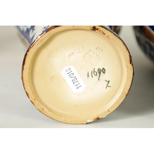 58 - A PAIR OF DOULTON LAMBETH STONEWARE TAPERED SHOULDERED VASES WITH FLARED NECKS decorated with raised... 