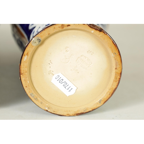 58 - A PAIR OF DOULTON LAMBETH STONEWARE TAPERED SHOULDERED VASES WITH FLARED NECKS decorated with raised... 