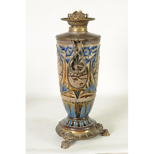 62 - A 19TH-CENTURY DOULTON STONEWARE AND GILT BRASS MOUNTED OIL LAMP DECORATED BY FLORENCE BARLOW the le... 