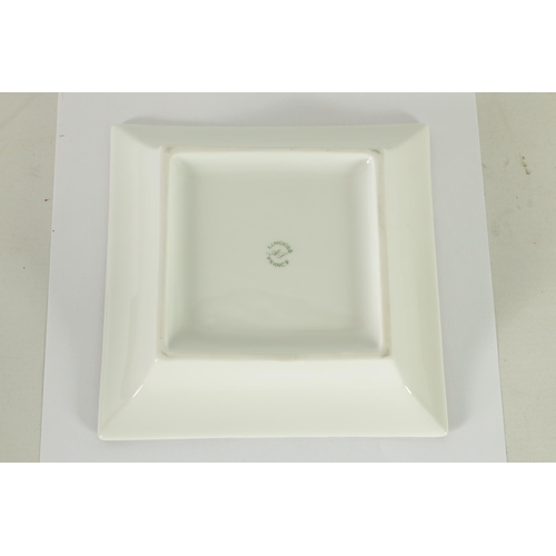 84 - A 1960’S BOXED OMEGA LIMOGES PORCELAIN OMEGA TRINKET DISH of square form with silver motif decoratio... 
