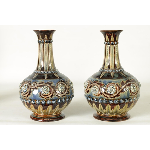 92 - A GOOD PAIR OF DOULTON LAMBETH FOOTED BULBOUS FLARED NECK VASES BEARING MONOGRAM FOR GEORGE TINWORTH... 