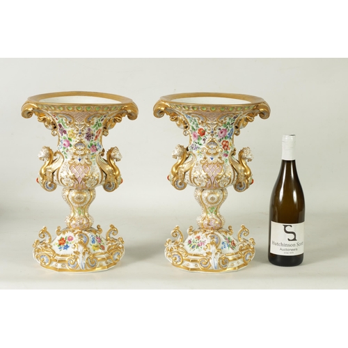 96 - A DECORATIVE PAIR OF LATE 19TH CENTURY CONTINENTAL DRESDEN STYLE URN SHAPED VASES with ornate gilt s... 