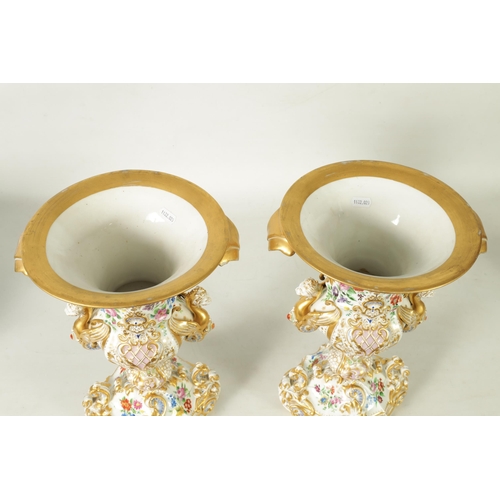 96 - A DECORATIVE PAIR OF LATE 19TH CENTURY CONTINENTAL DRESDEN STYLE URN SHAPED VASES with ornate gilt s... 