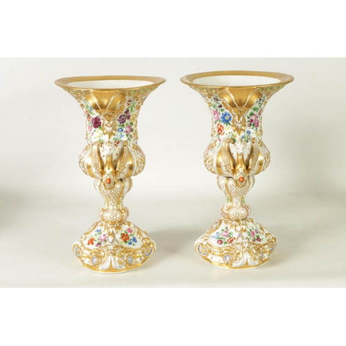 96 - A DECORATIVE PAIR OF LATE 19TH CENTURY CONTINENTAL DRESDEN STYLE URN SHAPED VASES with ornate gilt s... 