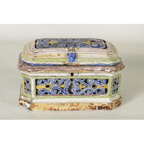 99 - A 17TH/18TH CENTURY POLYCHROME CONTINENTAL MAJOLICA CASKET AND COVER of canted rectangular form with... 