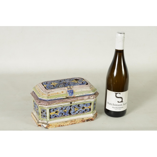 99 - A 17TH/18TH CENTURY POLYCHROME CONTINENTAL MAJOLICA CASKET AND COVER of canted rectangular form with... 