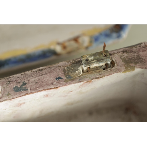 99 - A 17TH/18TH CENTURY POLYCHROME CONTINENTAL MAJOLICA CASKET AND COVER of canted rectangular form with... 