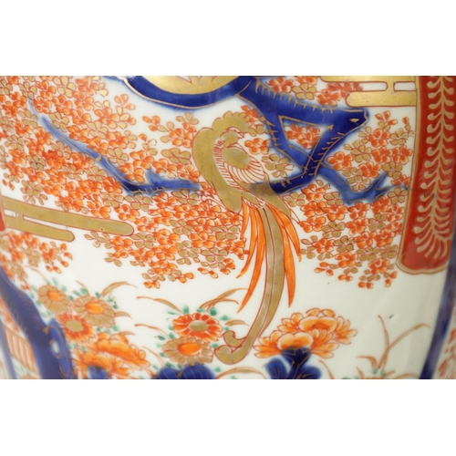 302 - A GOOD LARGE PAIR OF 19TH CENTURY IMARI TAPERING SHOULDERED VASES decorated in the traditional palet... 