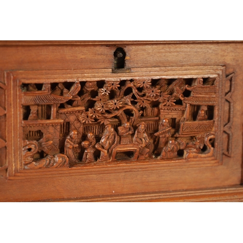305 - A LATE 19TH CENTURY CHINESE CARVED SANDALWOOD LIDDED JEWELLERY BOX profusely carved with landscape f... 