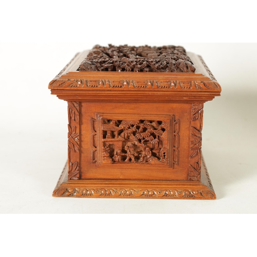 305 - A LATE 19TH CENTURY CHINESE CARVED SANDALWOOD LIDDED JEWELLERY BOX profusely carved with landscape f... 