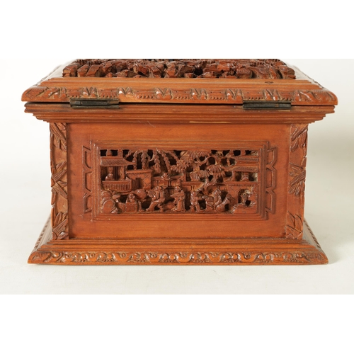 305 - A LATE 19TH CENTURY CHINESE CARVED SANDALWOOD LIDDED JEWELLERY BOX profusely carved with landscape f... 