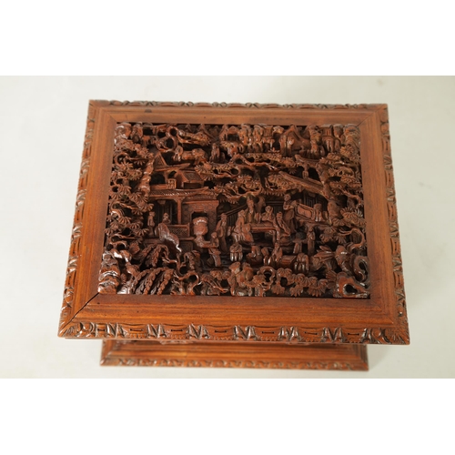 305 - A LATE 19TH CENTURY CHINESE CARVED SANDALWOOD LIDDED JEWELLERY BOX profusely carved with landscape f... 