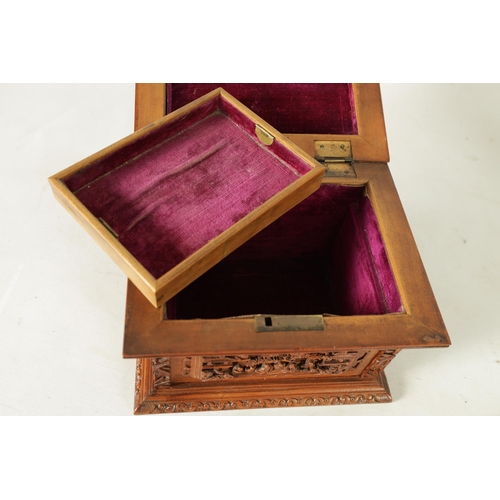305 - A LATE 19TH CENTURY CHINESE CARVED SANDALWOOD LIDDED JEWELLERY BOX profusely carved with landscape f... 