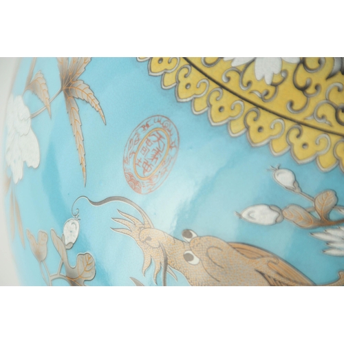 317 - A MASSIVE 20TH CENTURY CHINESE BULBOUS VASE WITH SLENDER NECK pale blue ground with scrolled leaf de... 